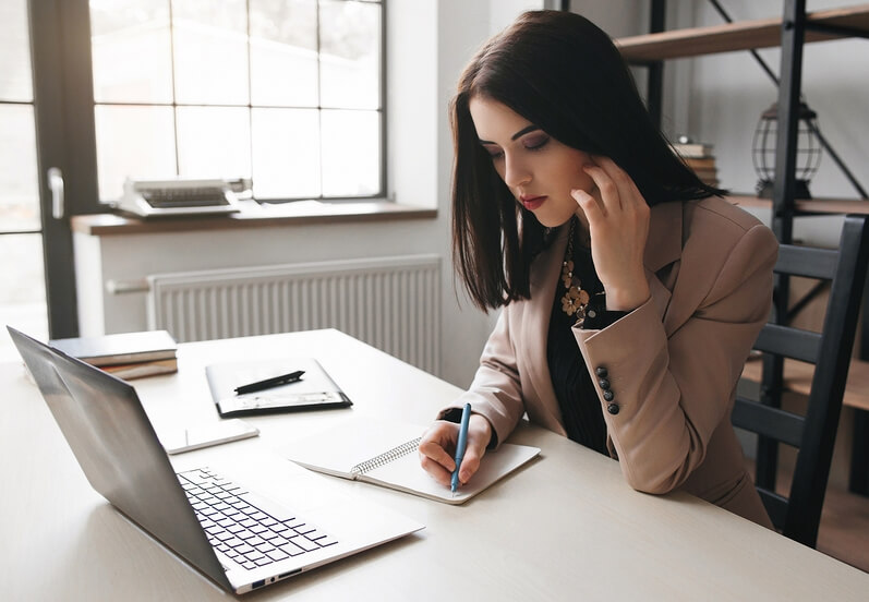 woman working alone in her business and feeling alienated