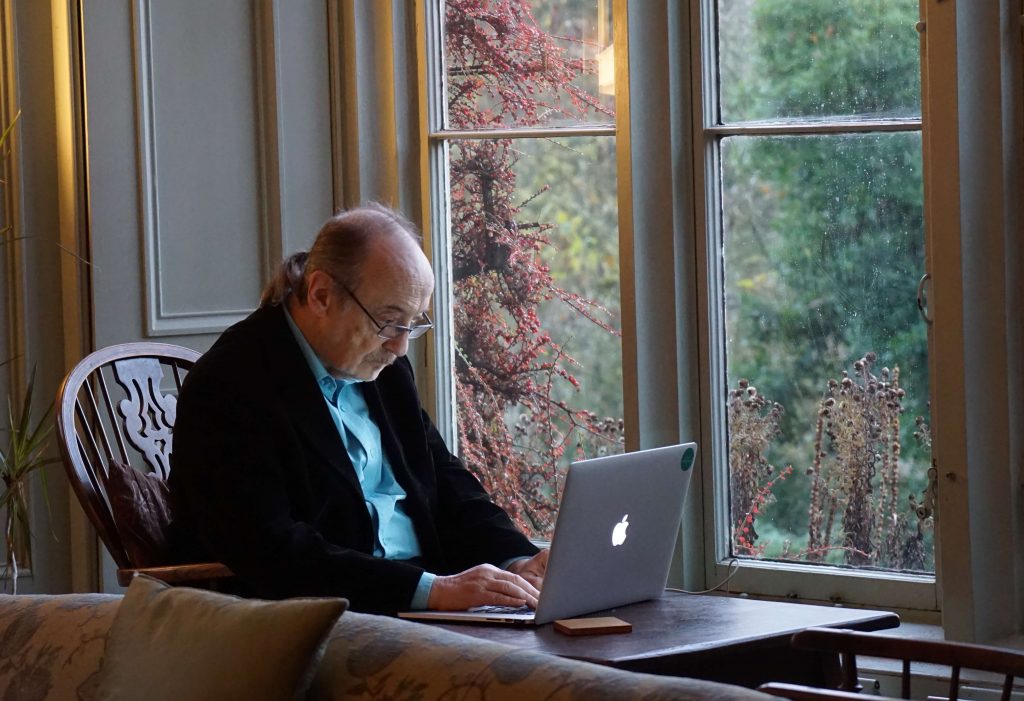 Man looking at a Facebood ad on computer